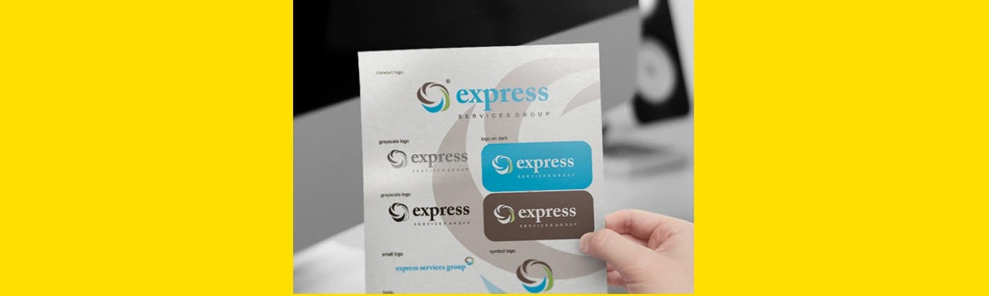 Hand holding the Express Services Group logo guidelines sheet